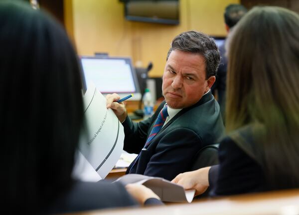 Brian McEvoy, attorney for Georgia Gov. Brian Kemp, confers with colleagues during a hearing on Kemp's motion to quash his subpoena from the special purpose grand jury in Atlanta on Thursday, Aug. 25, 2022. (Bob Andres/The Atlanta Journal Constitution/TNS)