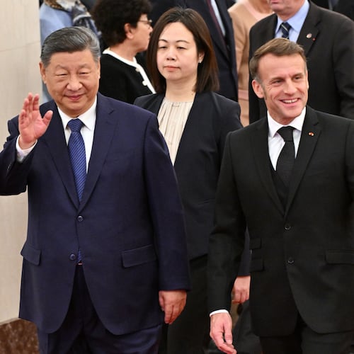 France's President Emmanuel Macron, right, and China's President Xi Jinping, left, walk during a state visit at the Great Hall of the People in Beijing Thursday, Dec. 4, 2025. (Adek Berry/Pool Photo via AP)