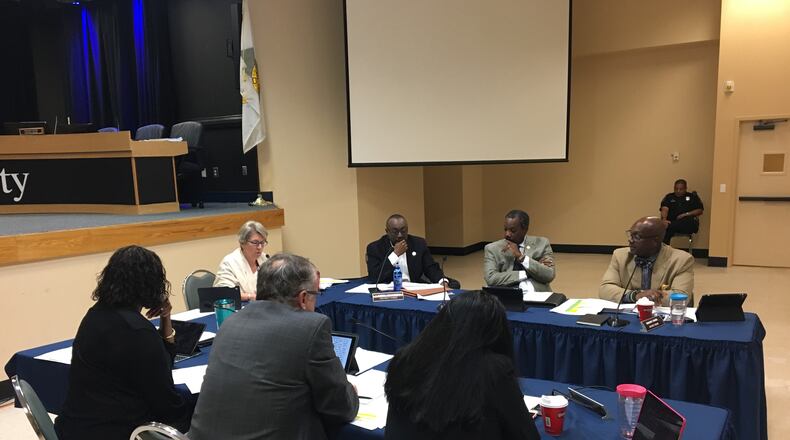The DeKalb Board of Commissioners voted Tuesday to approve a list of projects that would be funded by a special purpose local option sales tax (SPLOST) over the next six years. From left: Commissioners Mereda Davis Johnson, Kathie Gannon, Jeff Rader, Larry Johnson, Nancy Jester, Steve Bradshaw and Greg Adams. MARK NIESSE / MARK.NIESSE@AJC.COM