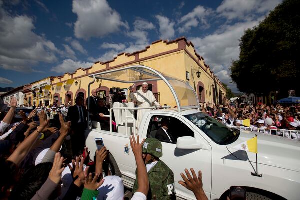FILE - Pope Francis waves from his popemobile as he leaves the Cathedral in San Cristobal de las Casas, Mexico, Feb. 15, 2016. (AP Photo/Eduardo Verdugo, File)