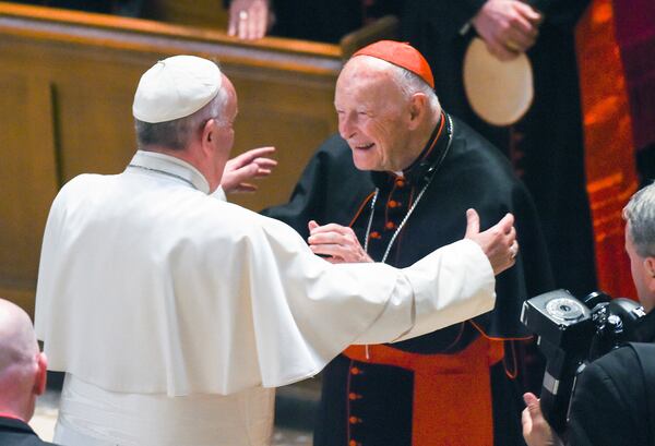 FILE - In this Sept. 23, 2015 file photo, Pope Francis reaches out to hug Cardinal Archbishop emeritus Theodore McCarrick after the Midday Prayer of the Divine with more than 300 U.S. Bishops at the Cathedral of St. Matthew the Apostle in Washington. (Jonathan Newton / The Washington Post via AP, Pool, File)