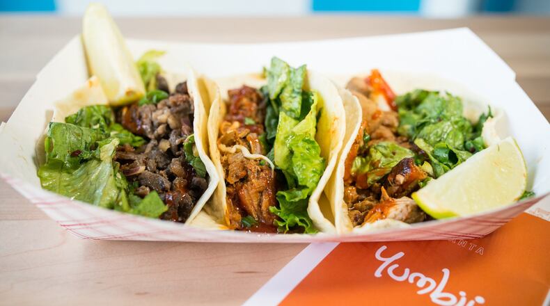 Spicy pulled-pork, Asian rib-eye beef, and chicken tacos. Photo credit- Mia Yakel.