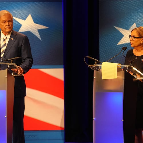 U.S. Rep. Ralph Norman, R-S.C., left, looks on as Sen. Darline Graham, R-S.C., speaks during a debate ahead of the special GOP Senate runoff election to replace the late Sen. Lindsey Graham, R-S.C., in Newberry, S.C., Tuesday, Aug. 18, 2026. (AP Photo/Meg Kinnard)