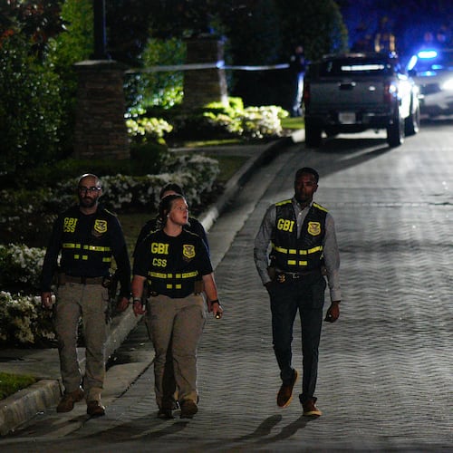 GBI officers investigate late Tuesday after Cobb police searched for a man wanted on an outstanding warrant for murder. The man, identified as 31-year-old Damian Strozier, has been located, according to Cobb police. (Ben Hendren for the AJC)