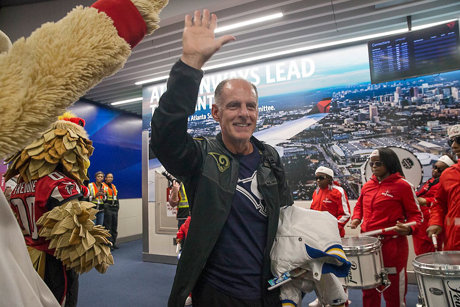 PHOTOS: Fans flock into Atlanta airport for Super bowl