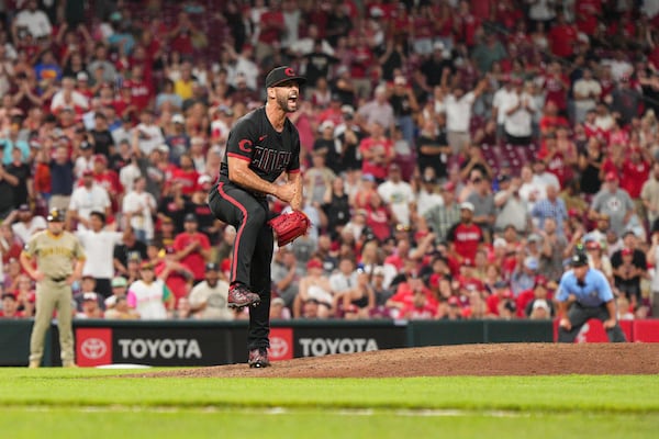Cincinnati Reds pitcher Nick Martinez reacts after striking out San Diego Padres' Jake Cronenworth to retire the side during the eighth inning of a baseball game, Friday, June 27, 2025, in Cincinnati. (AP Photo/Jeff Dean)