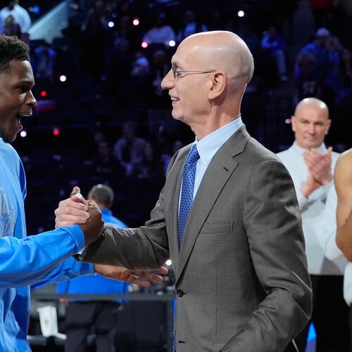 USA Stars guard Anthony Edwards, left, shakes hands with commissioner Adam Silver after the NBA All-Star basketball game Sunday, Feb. 15, 2026, in Inglewood, Calif. (AP Photo/Jae C. Hong)