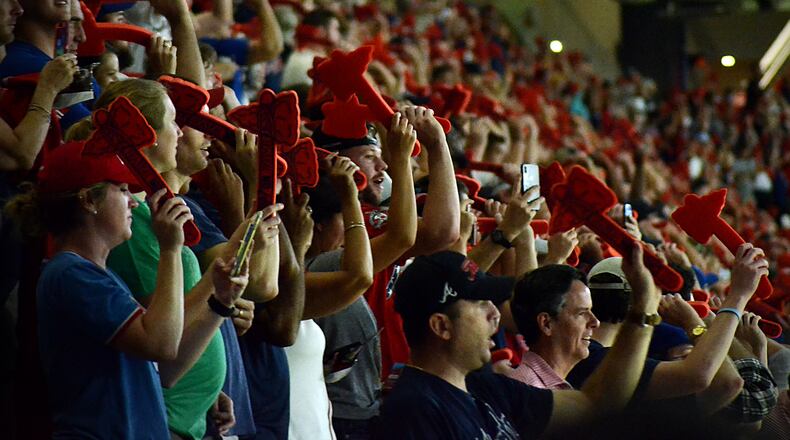 Fans of the Atlanta Braves wave foam tomahawks before the start of Game 3 of the NLDS at SunTrust Park on Sunday, Oct. 7, 2018.