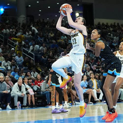 Indiana Fever guard Caitlin Clark, center left, drives to the basket past Chicago Sky forward/center Azura Stevens, center right, during the first half of a WNBA basketball game Sunday, Aug. 23, 2026, in Chicago. (AP Photo/Nam Y. Huh)