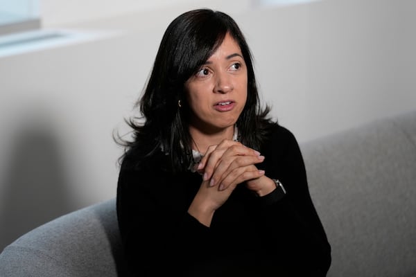 Casandra Almonte speaks to reporters in New York, Thursday, March 20, 2025. (AP Photo/Seth Wenig)