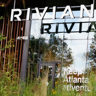 A Rivian logo is displayed at the front of their new headquarters near Krog Street Market on Tuesday, August 4, 2026. Rivian’s headquarters employs 130 people and is projected to grow to 500 by 2030. (Miguel Martinez/AJC)