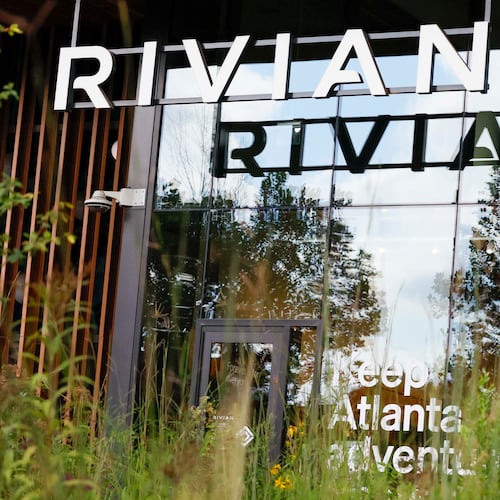 A Rivian logo is displayed at the front of their new headquarters near Krog Street Market on Tuesday, August 4, 2026. Rivian’s headquarters employs 130 people and is projected to grow to 500 by 2030. (Miguel Martinez/AJC)
