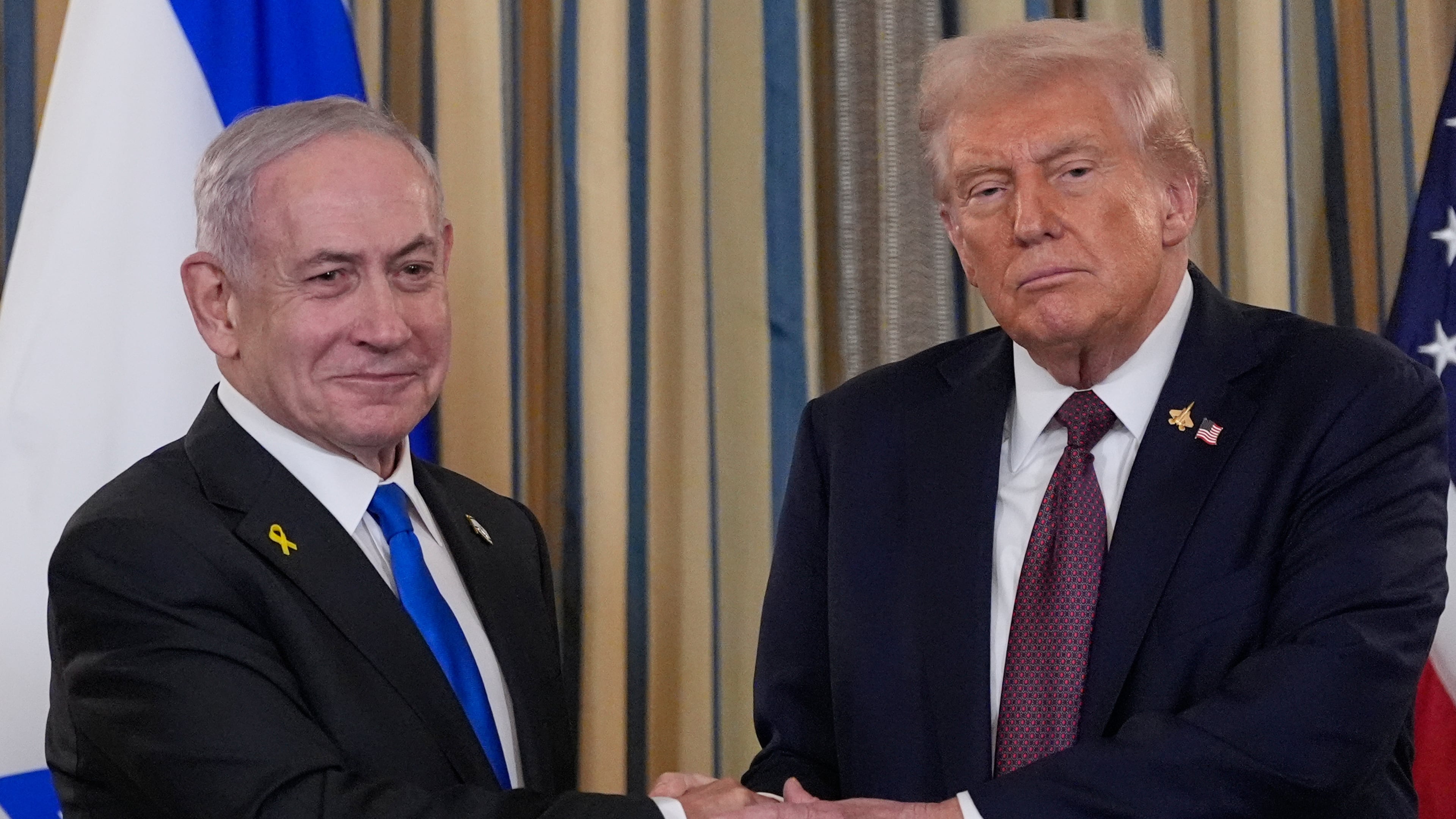 Israel's Prime Minister Benjamin Netanyahu shakes hands with President Donald Trump after a news conference in the State Dining Room of the White House, Monday, Sept. 29, 2025, in Washington. (AP Photo/Alex Brandon)