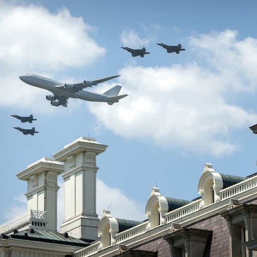 Military aircraft fly over the National Mall near the Eisenhower Executive Office Building on the White House complex, Friday, July 3, 2026, in Washington. (AP Photo/Mark Schiefelbein)