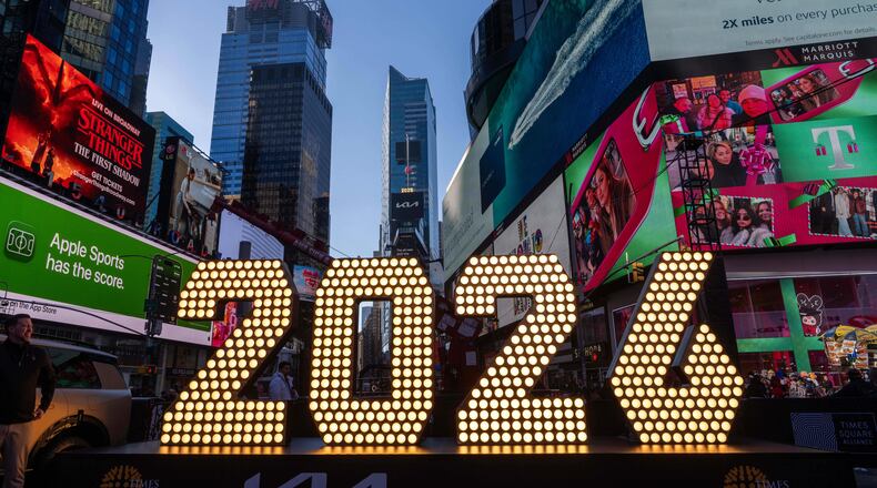 FILE - The 7-foot tall "2026" numerals are displayed at an illumination ceremony in Times Square, Thursday, Dec. 18, 2025, in New York. (AP Photo/Adam Gray, File)