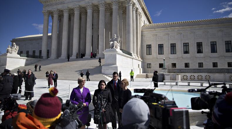 Stephanie Toti, senior counsel at the Center for Reproductive Rights, center, speaks to members of the media outside the U.S. Supreme Court with Amy Hagstrom Miller, founder and chief executive officer of Whole Woman's Health, left, and Nancy Northup, president and chief executive officer of the Center for Reproductive Rights, right, in Washington, on March 2, 2016. In a presidential campaign unlike any other, the U.S. Supreme Court has been treated almost as an afterthought, but that will change on Wednesday night.Debate moderator Chris Wallace of Fox News is making the high court one of six topics for the final debate between Donald Trump and Hillary Clinton, and the timing couldn't be better.