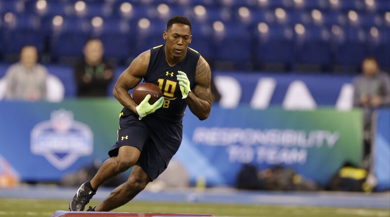 Clemson running back Wayne Gallman runs a drill at the NFL football scouting combine in Indianapolis, Friday, March 3, 2017. (AP Photo/Michael Conroy)