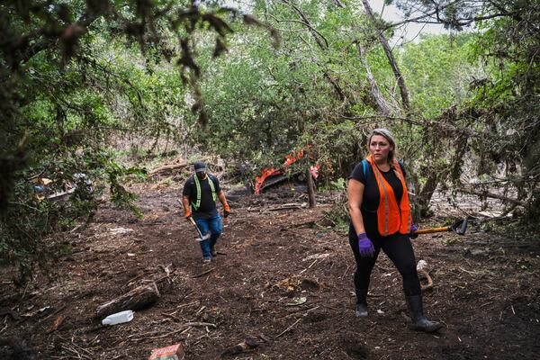 Volunteers carry out search and rescue operations near the Guadalupe River after a flash flood swept through the area Monday, July 7, 2025, in Ingram, Texas. (AP Photo/Eli Hartman)