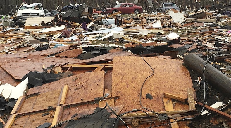 Mobile homes and vehicles in Cook County were destroyed by severe weather that struck over the weekend, killing at least 15 people in south Georgia. (AP Photo/Brendan Farrington)