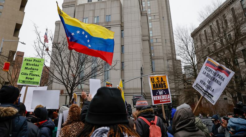 People protest outside Manhattan Federal Court before the arraignment of Venezuelan President Nicolas Maduro, Monday, Jan. 5, 2026, in New York. (AP Photo/Stefan Jeremiah)