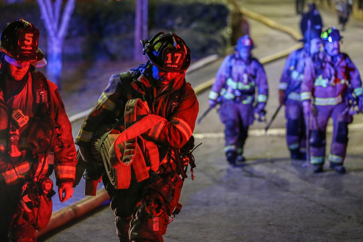 Atlanta firefighters respond to a fatal blaze at Venetian Hills Apartments on Campbellton Road in Atlanta on March 15, 2017. A $140 million verdict awarded to the family of the tenant who died in the fire was erased Friday by the Georgia Court of Appeals. (John Spink/AJC file)