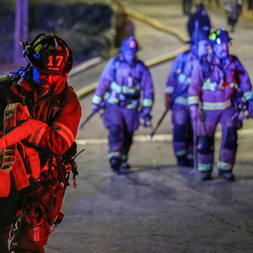 Atlanta firefighters respond to a fatal blaze at Venetian Hills Apartments on Campbellton Road in Atlanta on March 15, 2017. A $140 million verdict awarded to the family of the tenant who died in the fire was erased Friday by the Georgia Court of Appeals. (John Spink/AJC file)