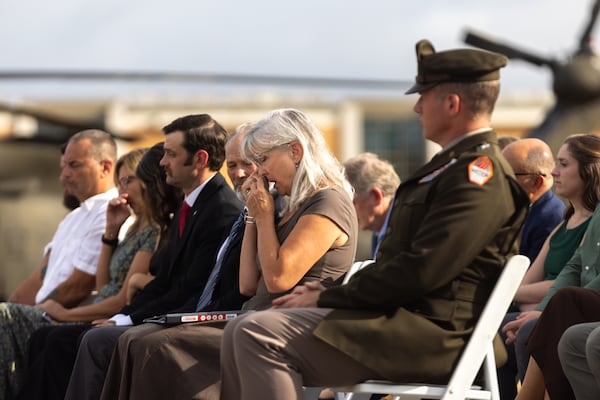 Friends and family of Delta Force Master Sgt. Gary Gordon, including his widow, Carmen Owens (center), attended a base renaming ceremony at Fort Gordon in Augusta on Friday, Sept. 26, 2025.  (Arvin Temkar/AJC)