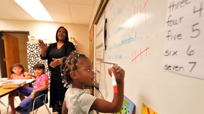 SNELLVILLE Students in Kambrietta Payne’s 1st grade blended math and science class work on problems at Centerville Elementary School Friday, August 29, 2014. Georgia school districts must decide whether they will push more authority down to the school level or face potential financial losses. The state mandate to consider choosing either a charter form of management, the status quo or something in between called “IE2” is driven by the notion that more local control will improve outcomes. KENT D. JOHNSON / KDJOHNSON@AJC.COM