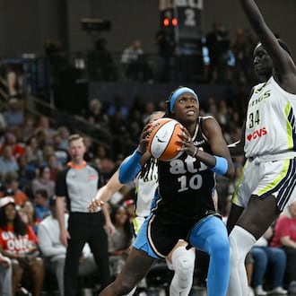 Dream guard Rhyne Howard (left), shown here driving against Wings forward Awak Kuier last month, led all scorers with 22 first-half points during their matchup against the Sun on Tuesday. (Hyosub Shin/AJC)