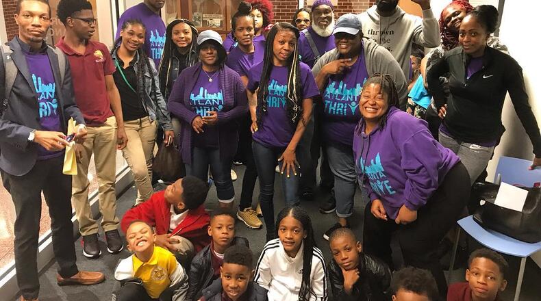 These are some of the parents involved in the Atlanta Thrive parents group. Kimberly Dukes, standing in the center with long braids, is the leader and co-founder. She writes today about the pressing need for radical change in APS.