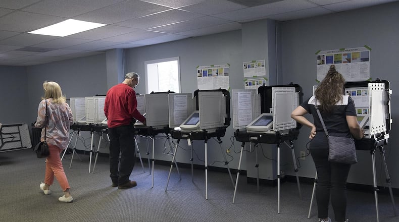 Gwinnett County residents casts their ballots last March. (ALYSSA POINTER/ALYSSA.POINTER@AJC.COM) AJC FILE PHOTO