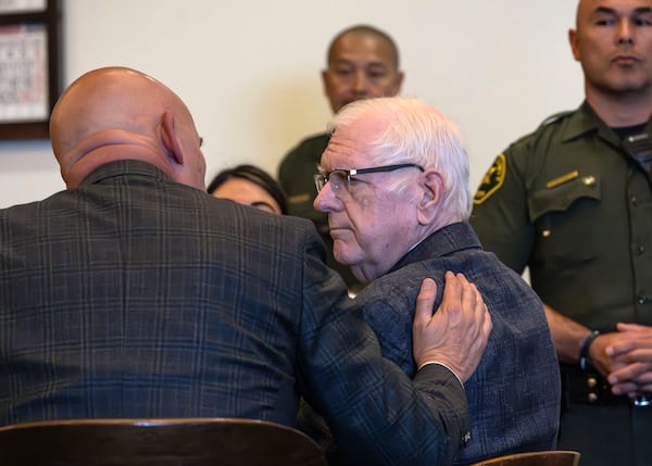 An Orange County Superior Court jury found Orange County Superior Court Judge Jeffrey Ferguson guilty of second-degree murder in the 2023 shooting death of his wife Sheryl Ferguson, is consoled by his attorney, Cameron Talley, after the verdict was read Tuesday, April 22, 2025, in Santa Ana, Calif. (Mindy Schauer/The Orange County Register via AP, Pool)