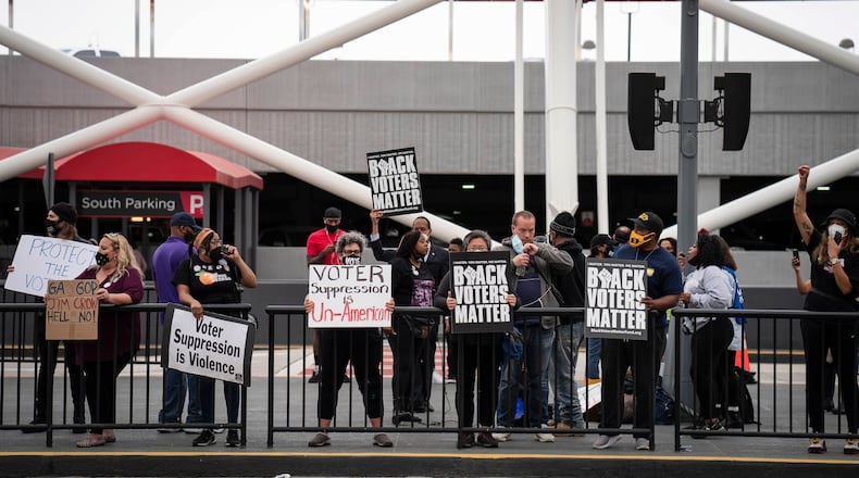 Voting-rights activists call for a boycott of Delta Air Lines during a protest at Hartsfield-Jackson Atlanta International Airport in Atlanta, March 25, 2021. With lawmakers around the country advancing restrictive voting rights bills that would disproportionately impact Black voters, much of corporate America has gone quiet. (Nicole Craine/The New York Times)