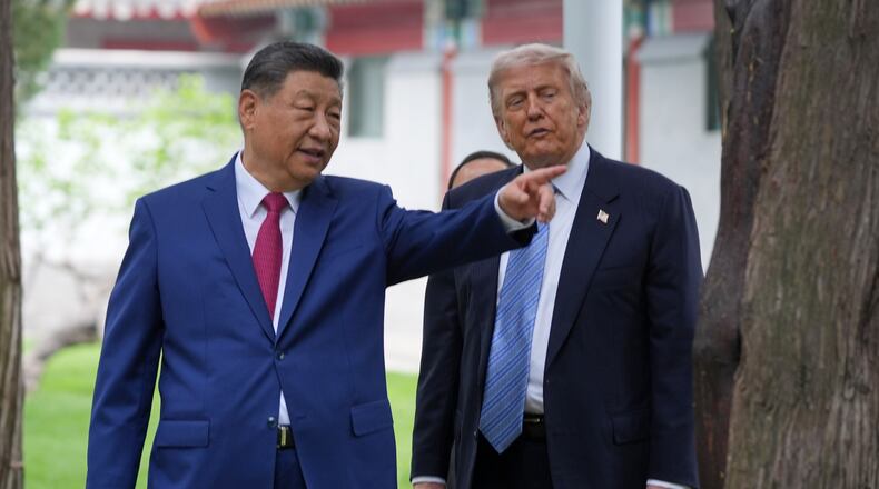 FILE - President Donald Trump talks with China's President Xi Jinping at the Zhongnanhai leadership compound, May 15, 2026, in Beijing. (AP Photo/Mark Schiefelbein, Pool, File)