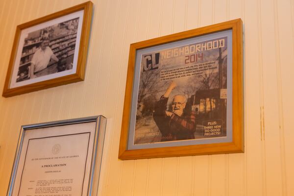 A framed copy of the 2014 Creative Loafing cover features Ronnie Edwards on the wall of Little’s Food Store. Edwards was one of the last of the so-called Old Cabbageheads who worked in Cabbagetown's cotton mill. (Jason Getz/AJC)