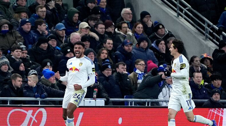 Leeds United's James Justin, left, celebrates scoring during the English Premier League soccer match between Everton and Leeds United in Liverpool, England, Monday Jan. 26, 2026. (Peter Byrne/PA via AP)