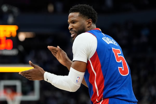 Detroit Pistons guard Malik Beasley claps after a shot clock violation against the Minnesota Timberwolves during the first half of an NBA basketball game, Sunday, March 30, 2025, in Minneapolis. (AP Photo/Abbie Parr)