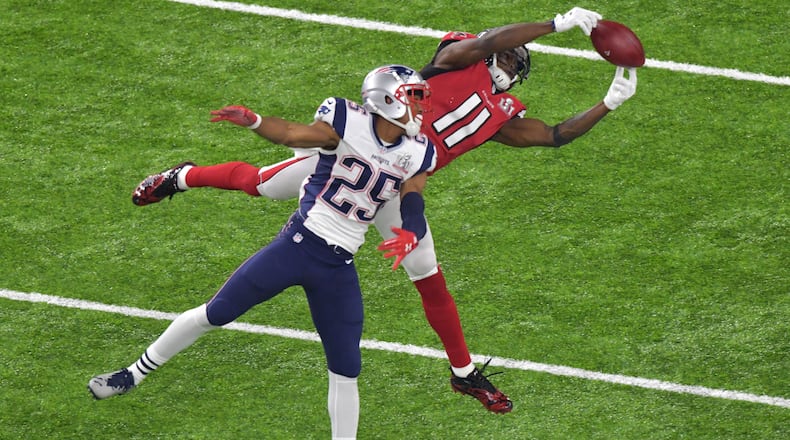 No. 5 -- Julio's catch: Falcons WR Julio Jones (11) extends to make a catch over Patriots CB Eric Rowe (25) in the second half. Hyosub Shin/hshin@ajc.com