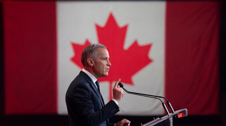 Canada's Prime Minister Mark Carney speaks at the Liberal national convention in Montreal, Saturday, April 11, 2026. (Christinne Muschi/The Canadian Press via AP)