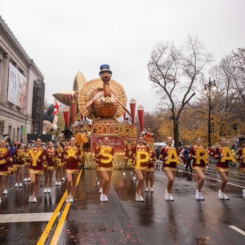 FILE - Parade performers lead the Tom Turkey float down Central Park West at the start of the Macy's Thanksgiving Day parade in New York on Nov. 28 2024. (AP Photo/Yuki Iwamura, File)