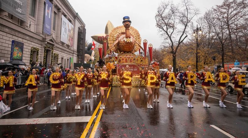 FILE - Parade performers lead the Tom Turkey float down Central Park West at the start of the Macy's Thanksgiving Day parade in New York on Nov. 28 2024. (AP Photo/Yuki Iwamura, File)