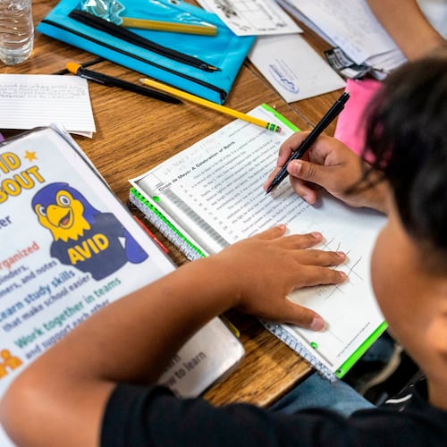 FILE - Sixth graders read a passage and give constructive feedback to their partners during a class at Fairview Elementary School, May 6, 2026, in Modesto, Calif. (AP Photo/Annie Barker, File)