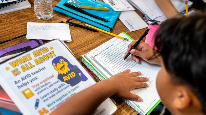 FILE - Sixth graders read a passage and give constructive feedback to their partners during a class at Fairview Elementary School, May 6, 2026, in Modesto, Calif. (AP Photo/Annie Barker, File)