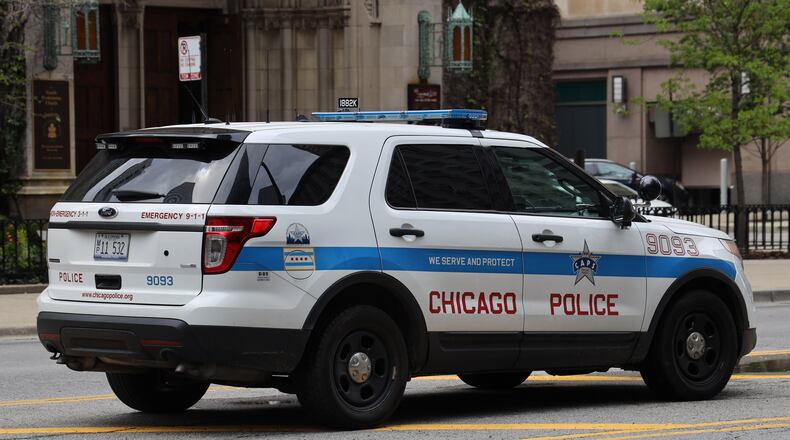 A civilian police review board confirmed Tuesday it is investigating allegations that Chicago police officers serving a search warrant last year barged into the wrong home and handcuffed a naked woman who lived there. (Dreamstime/TNS)