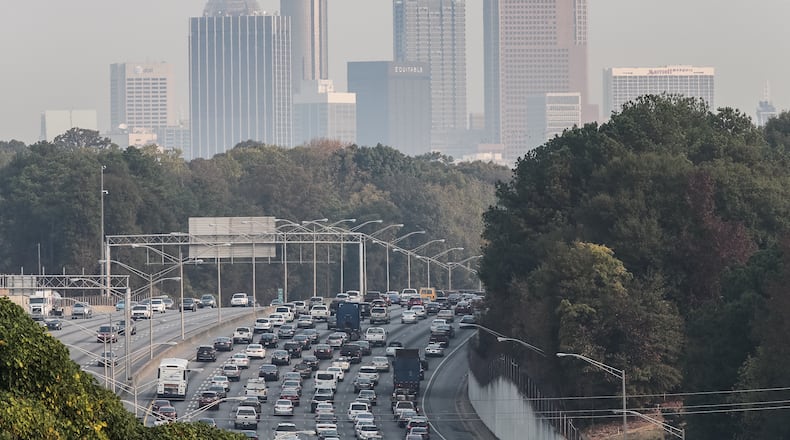 Wildfires in North Georgia sent smoke into metro Atlanta on Monday. JOHN SPINK / JSPINK@AJC.COM