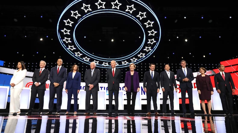 Democratic presidential candidates U.S. Rep. Tulsi Gabbard, from left, billionaire Tom Steyer, U.S. Sen. Cory Booker, U.S. Sen. Kamala Harris, U.S. Sen. Bernie Sanders, former Vice President Joe Biden, U.S. Sen. Elizabeth Warren, South Bend, Ind., Mayor Pete Buttigieg, former tech executive Andrew Yang, former U.S. Rep. Beto O’Rourke, U.S. Sen. Amy Klobuchar and former U.S. Housing and Urban Development Secretary Julian Castro gather on the stage at the start of Tuesday night’s presidential debate at Otterbein University in Westerville, Ohio. (Photo by Chip Somodevilla/Getty Images)