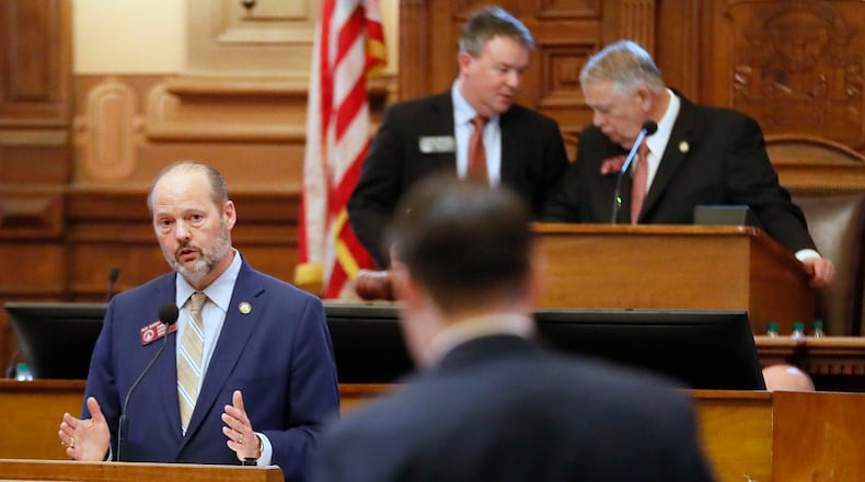 2/26/19 - Atlanta - Rep. Barry Fleming (left), R - Harlem, answers questions from the floor after he presented the bill. The Georgia House passed a bill Tuesday to buy a new $150 million election system that includes a paper ballot printed with a ballot marking device. But opponents to the bill, including many Democrats, say it would still leave Georgia's elections vulnerable to hacking and tampering. Bob Andres / bandres@ajc.com