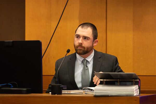 Sandy Springs police detective Isaiah Tomlin testifies at a hearing in the case against Shannen Grimes on Wednesday, Dec. 10, 2025. (Ben Hendren for the AJC)