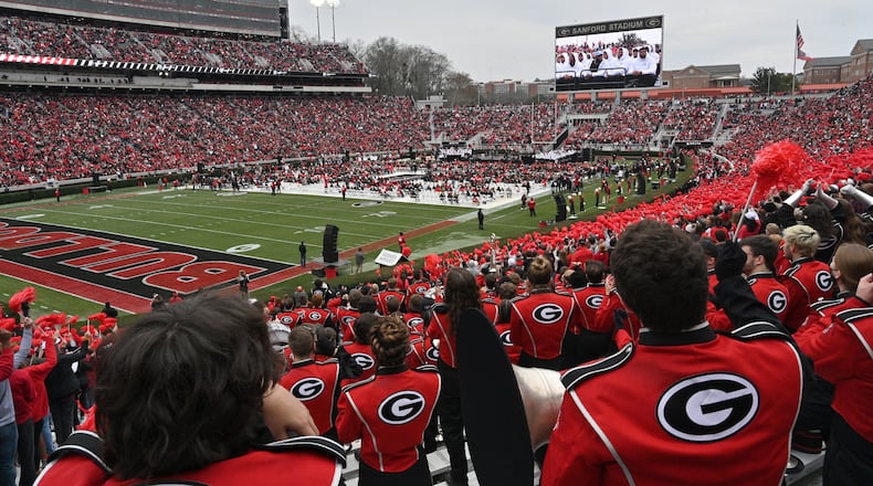 Georgia fans cheer as players take on the stage during the celebration of Georgia’s College Football Playoff national championship at Sanford Stadium in Athens on Saturday, January 15, 2022. Georgia captured the national championship, its first since the 1980 season, with a 33-18 victory over Alabama at Lucas Oil Stadium in Indianapolis. (Hyosub Shin / Hyosub.Shin@ajc.com)