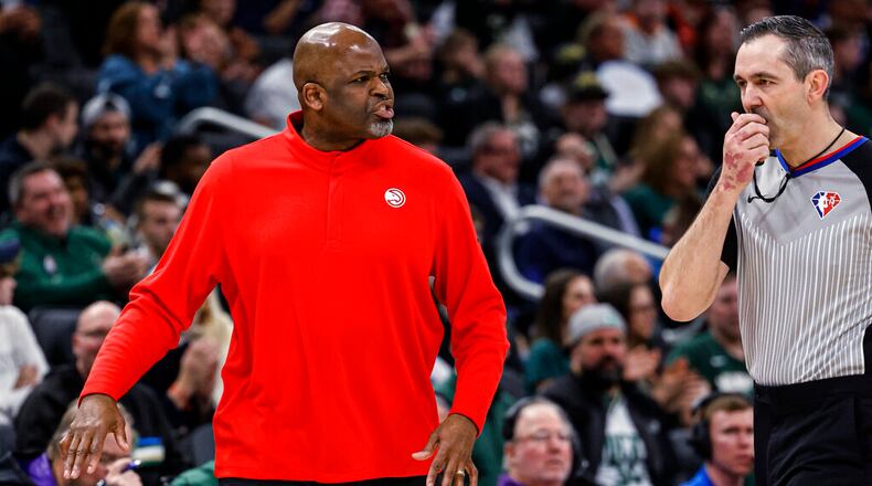 Hawks coach Nate McMillan is called for a technical foul by referee Brett Nansel during the team's NBA basketball game against the Milwaukee Bucks on Wednesday, March 9, 2022, in Milwaukee. (AP Photo/Jeffrey Phelps)